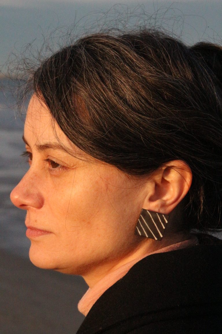 woman wearing ceramic earring