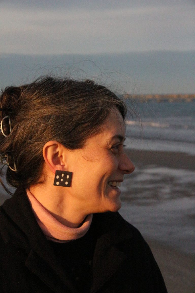 woman wearing ceramic earring