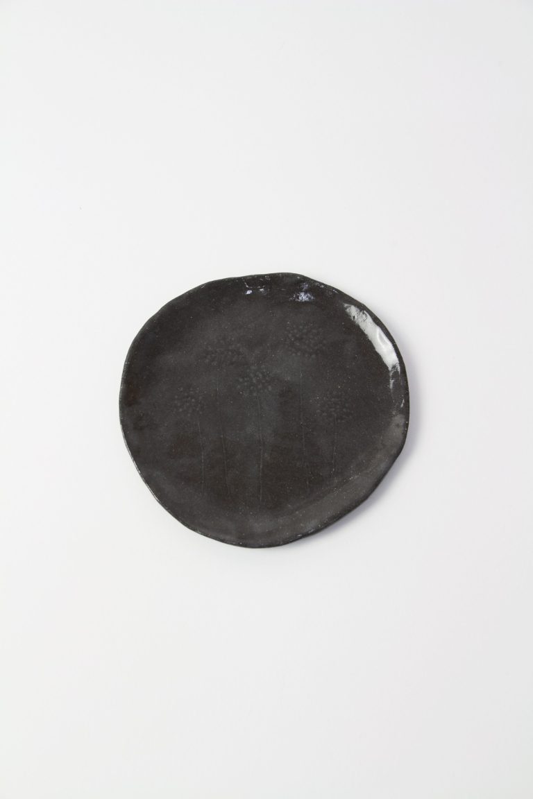 ceramic dish with plant engraving