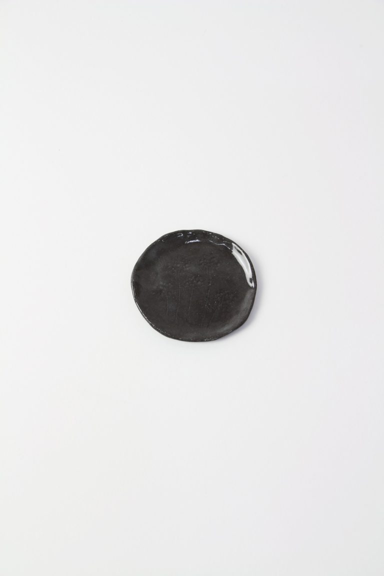 ceramic dish with plant engraving