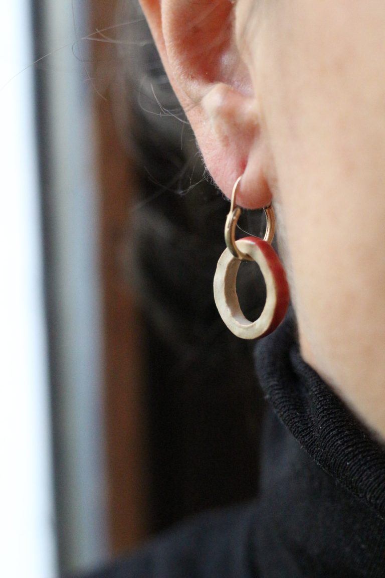 woman wearing ceramic earring hanger