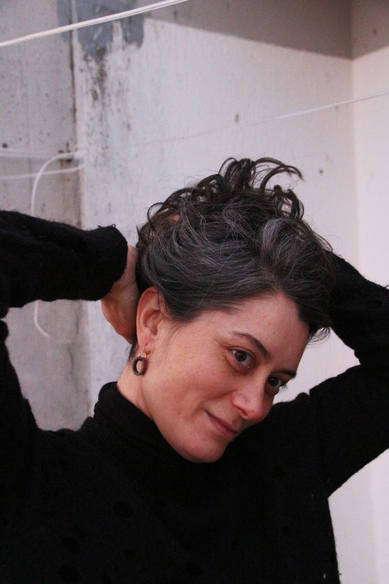 woman wearing ceramic earring hangers