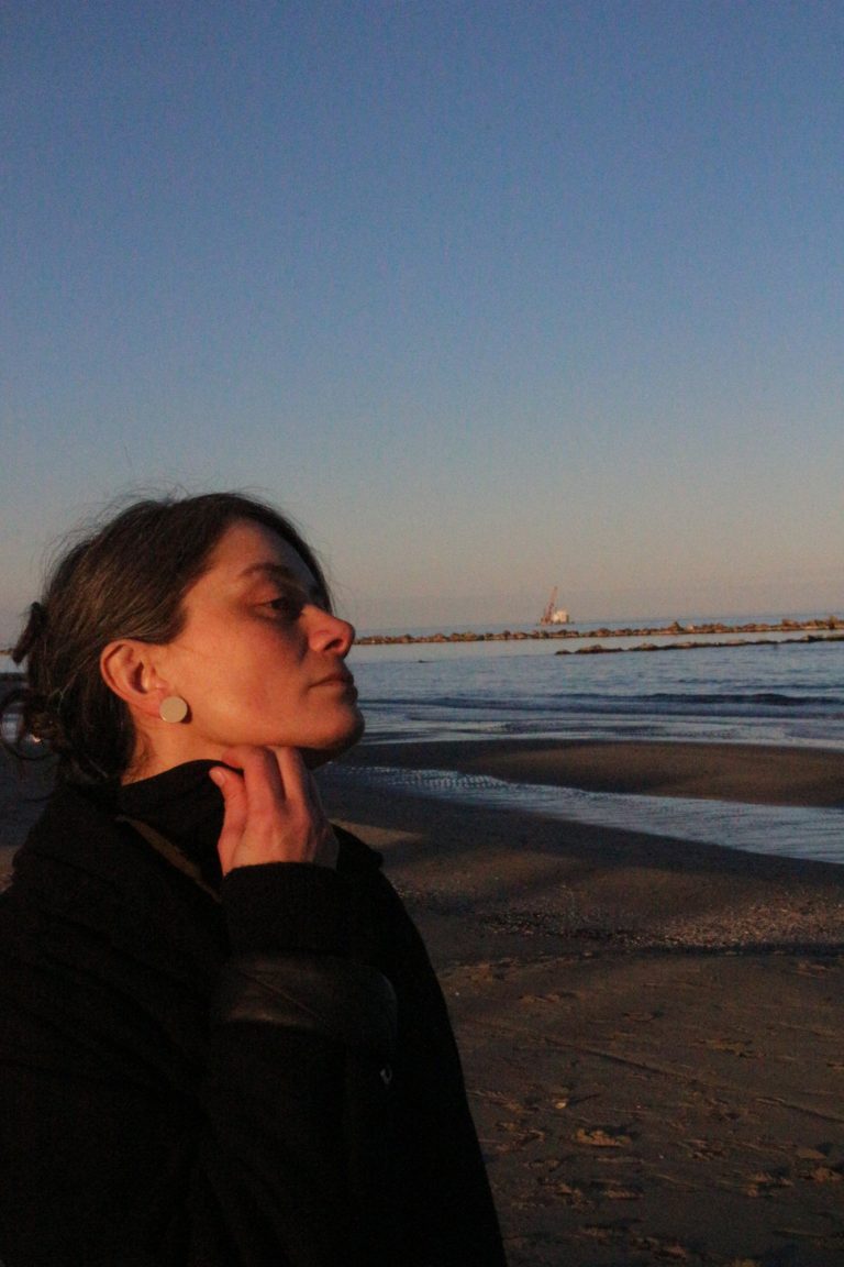 woman wearing ceramic earring
