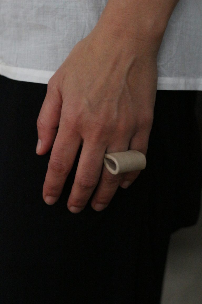 hand wearing ceramic ring