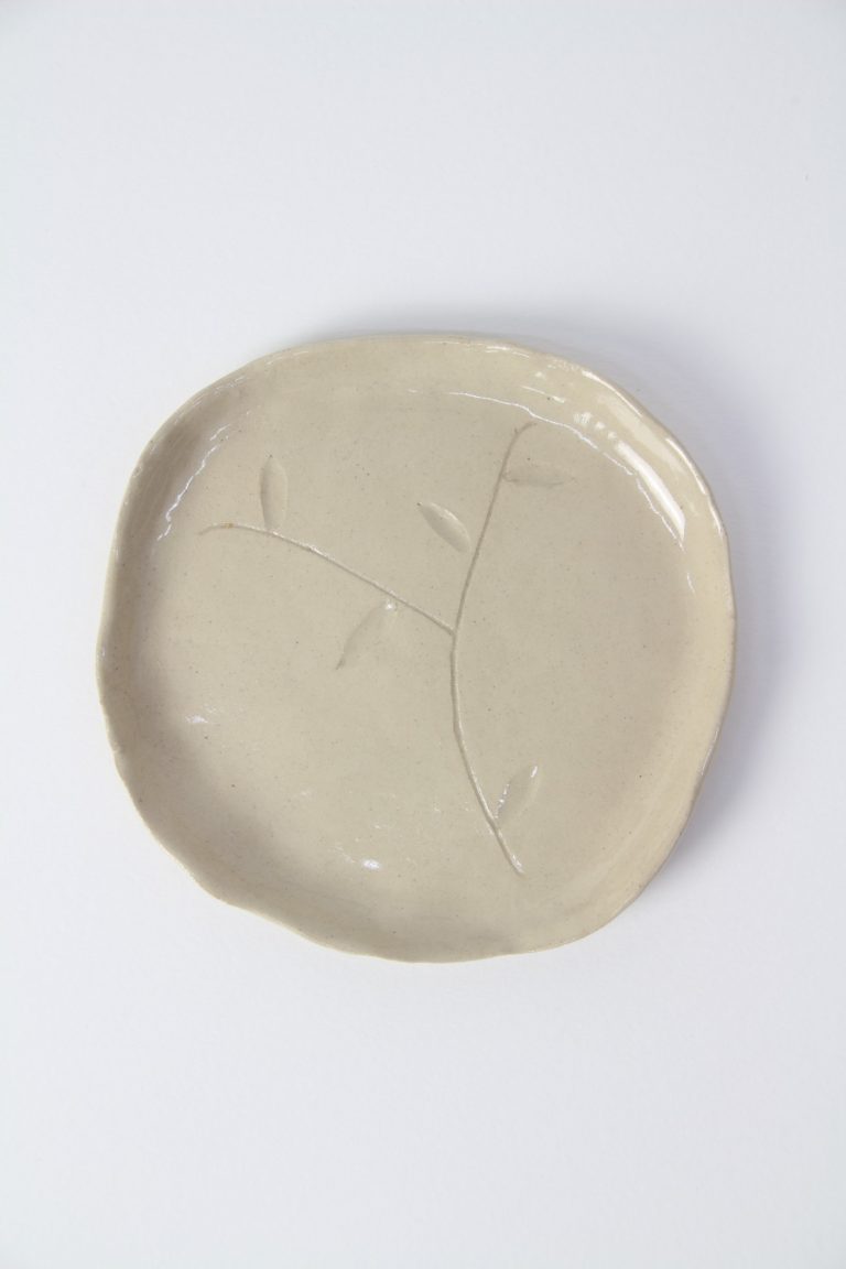 ceramic dish with plant engraving