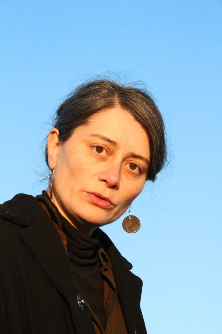 woman wearing ceramic earring