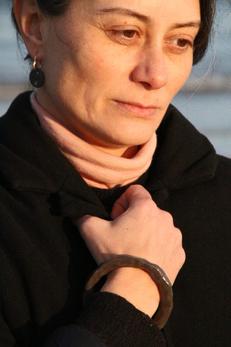arm wearing ceramic bracelet