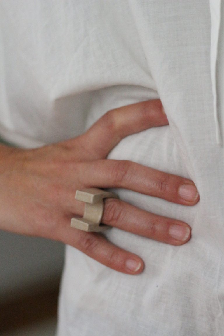 hand wearing ceramic ring