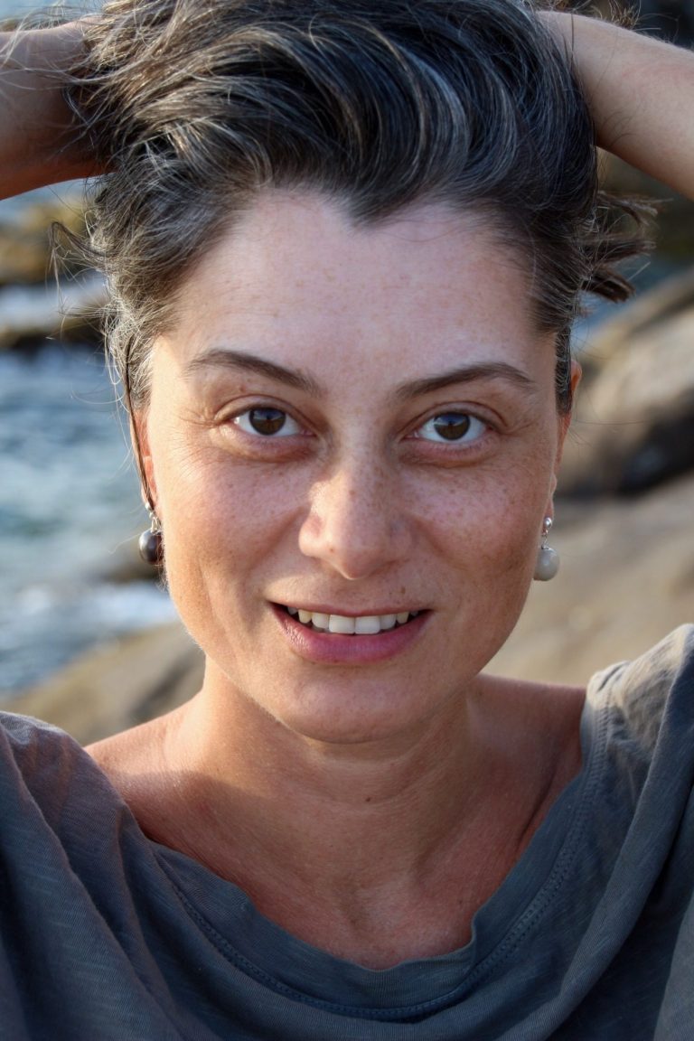 woman at the beach with eyes closed
