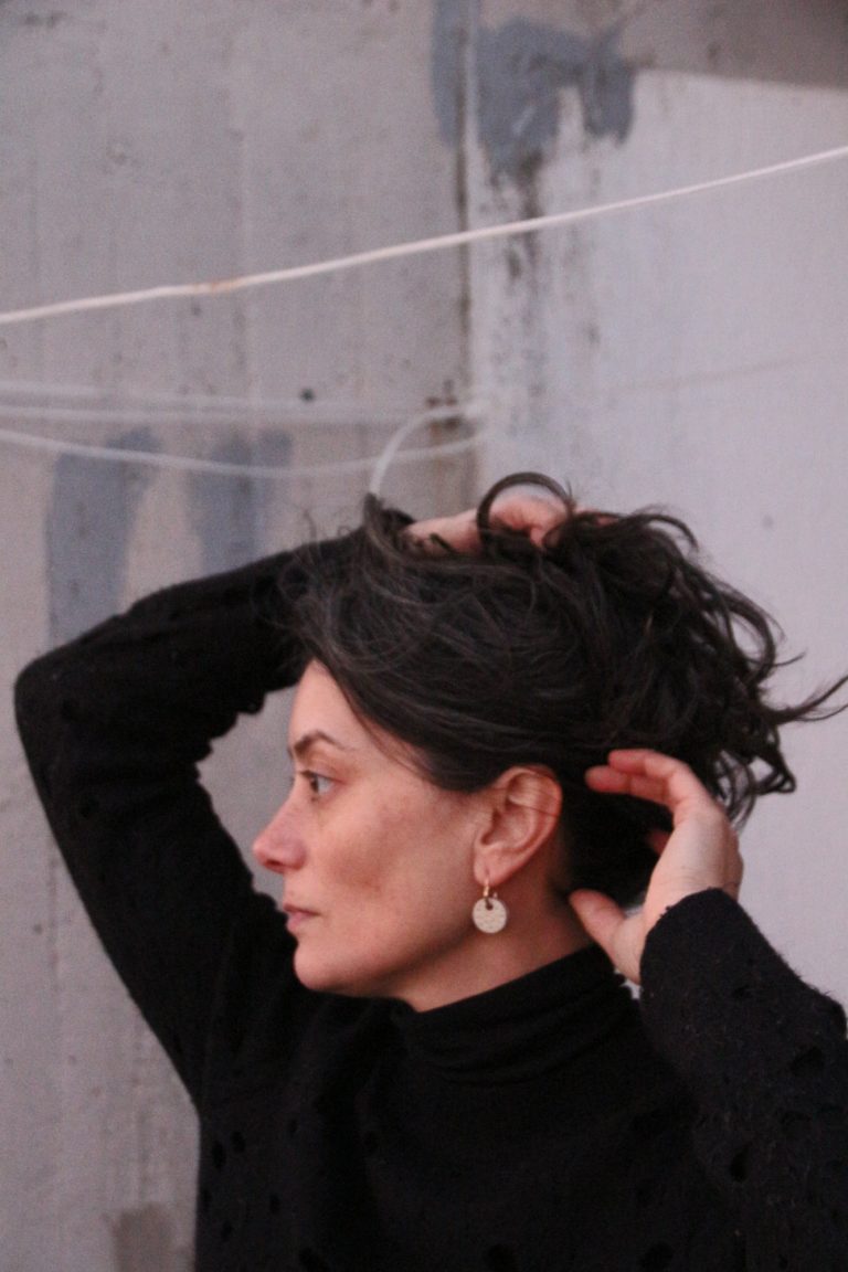 woman wearing ceramic earring hanger