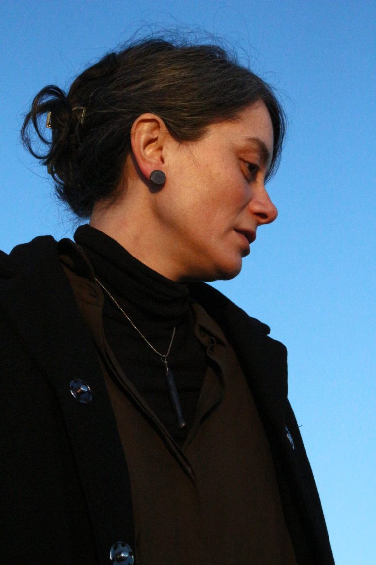 woman wearing ceramic earring