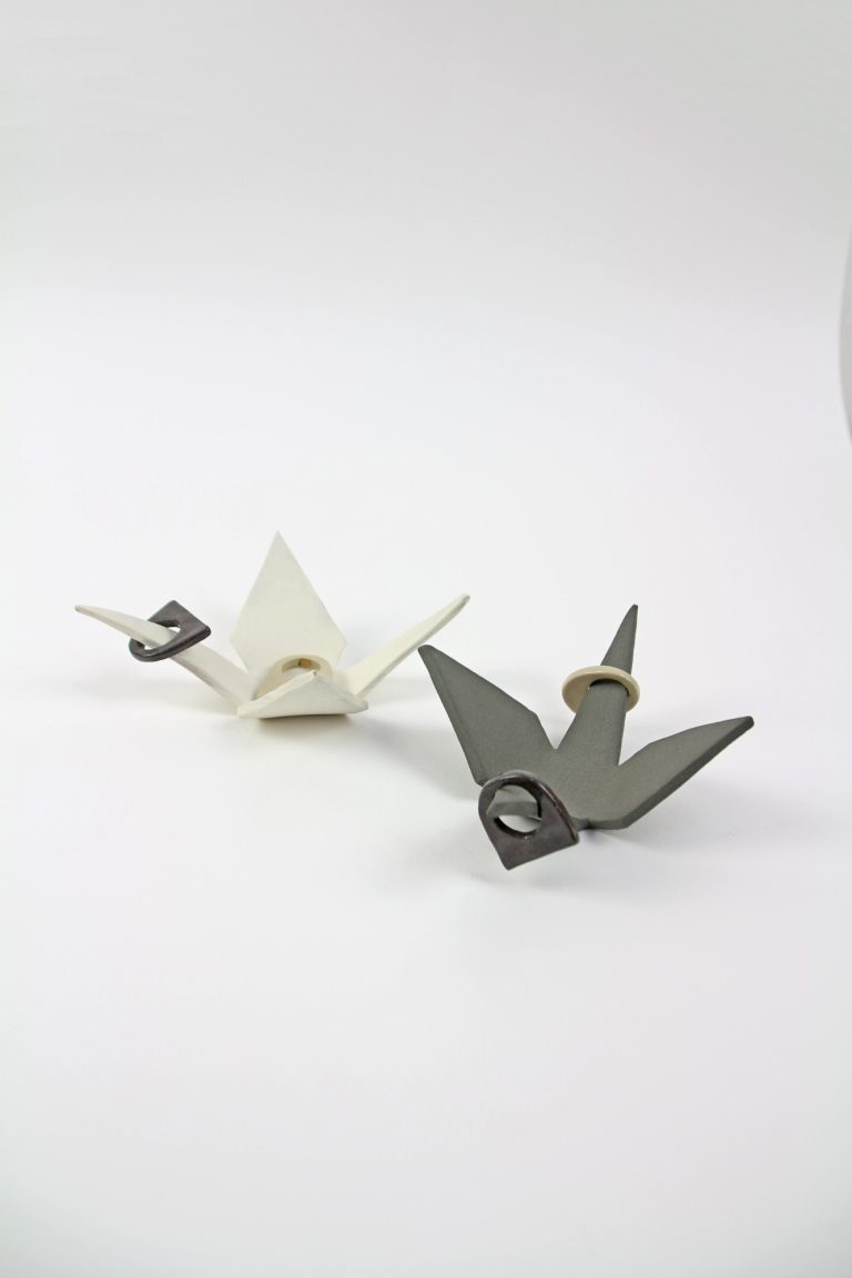 ceramic cranes with rings on top