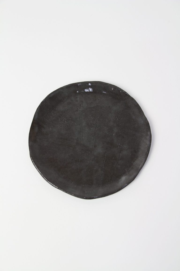 ceramic dish with plant engraving