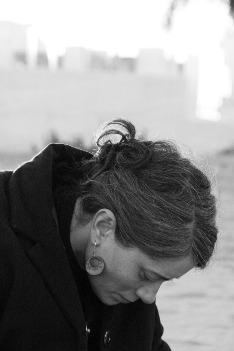 woman wearing ceramic earring