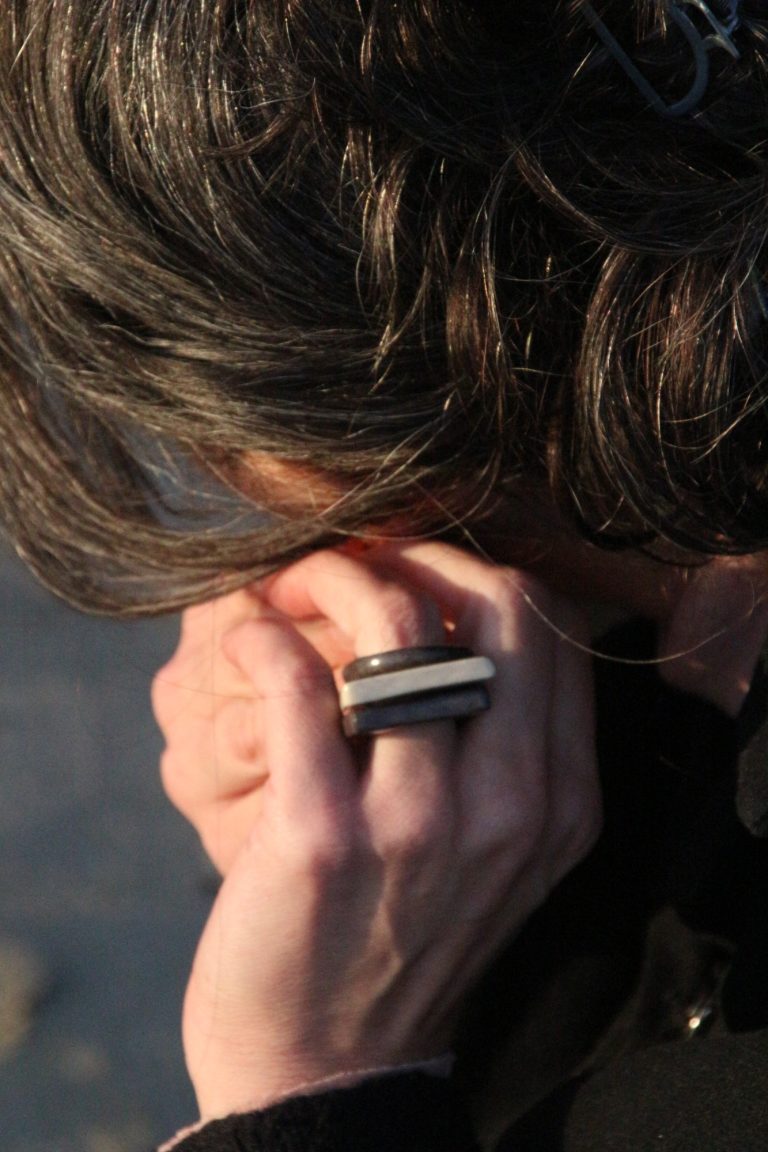 hand wearing a ceramic ring