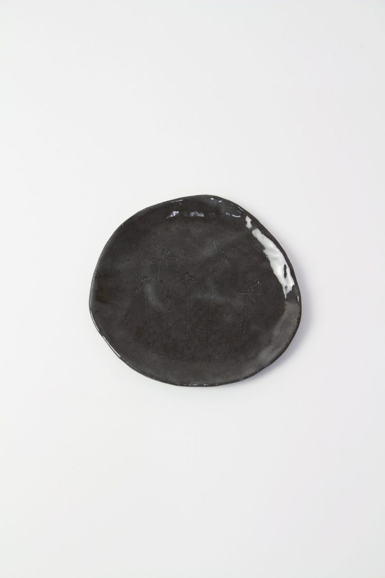 ceramic dish with plant engraving
