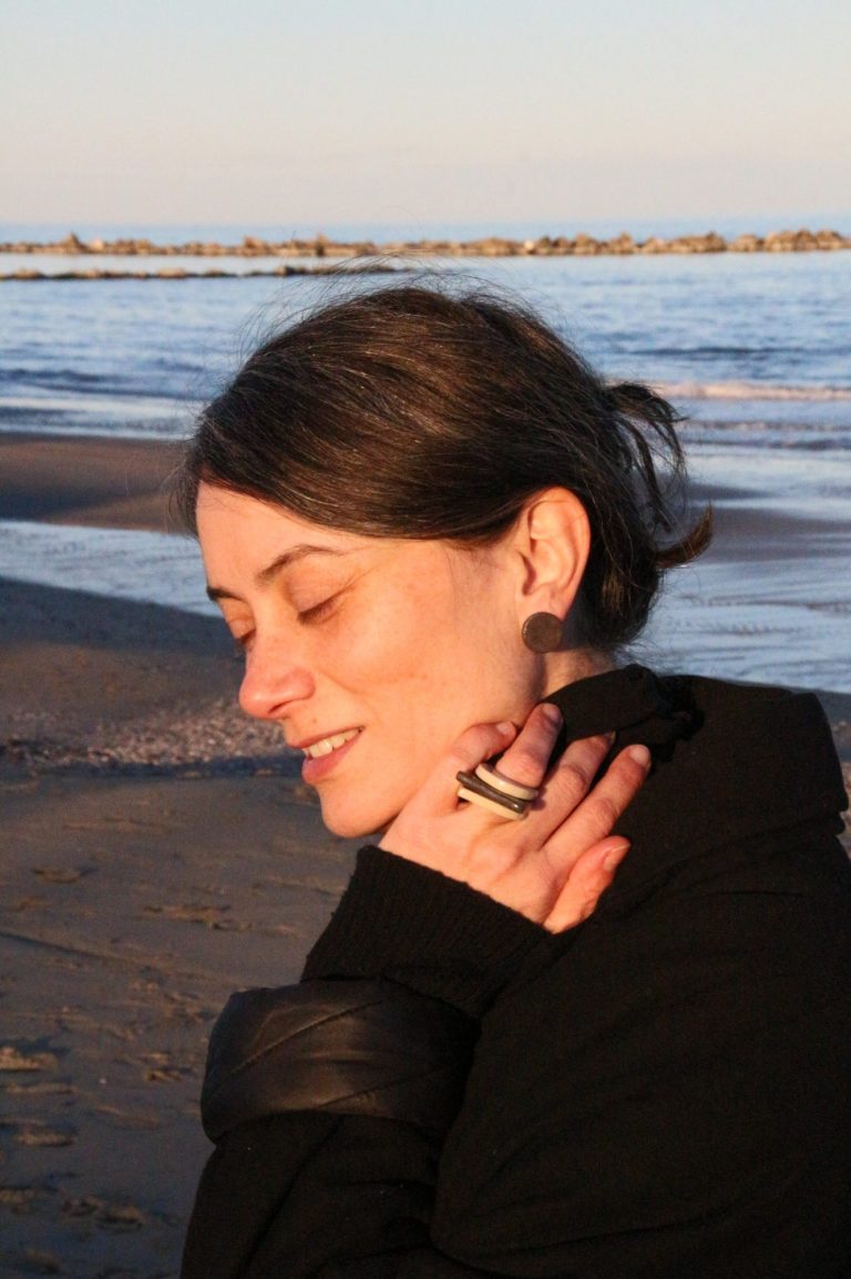 woman at the beach with eyes closed