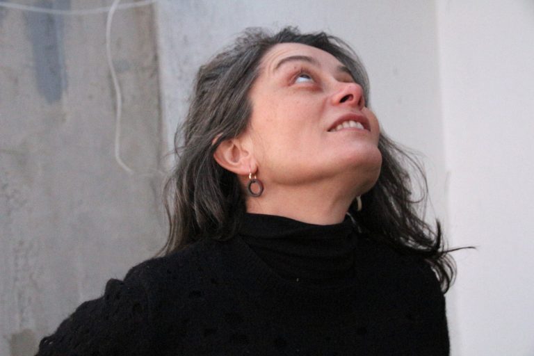 woman wearing ceramic earring hanger