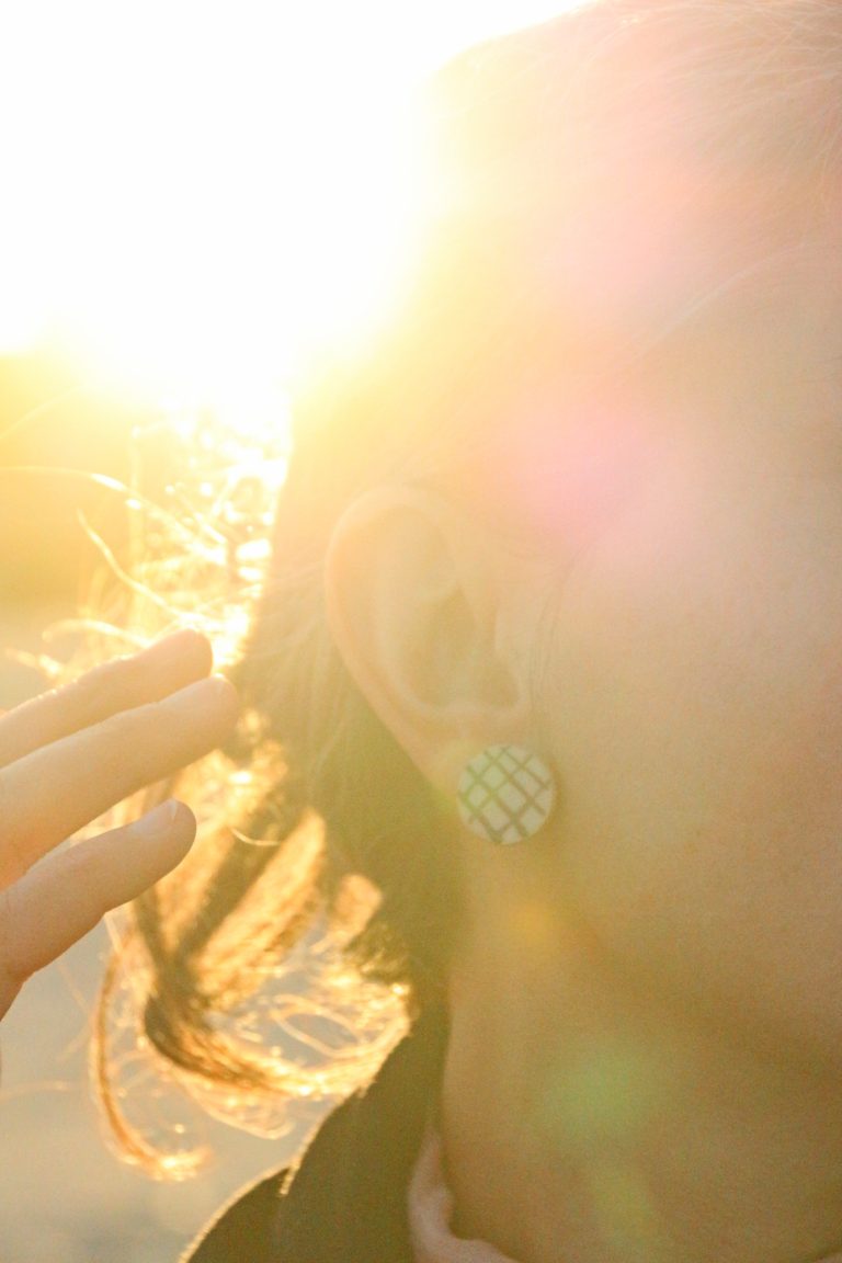 woman wearing ceramic earring