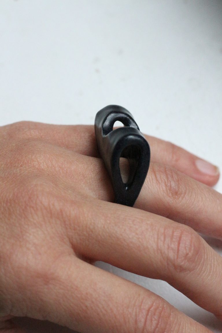 hand wearing ceramic rings