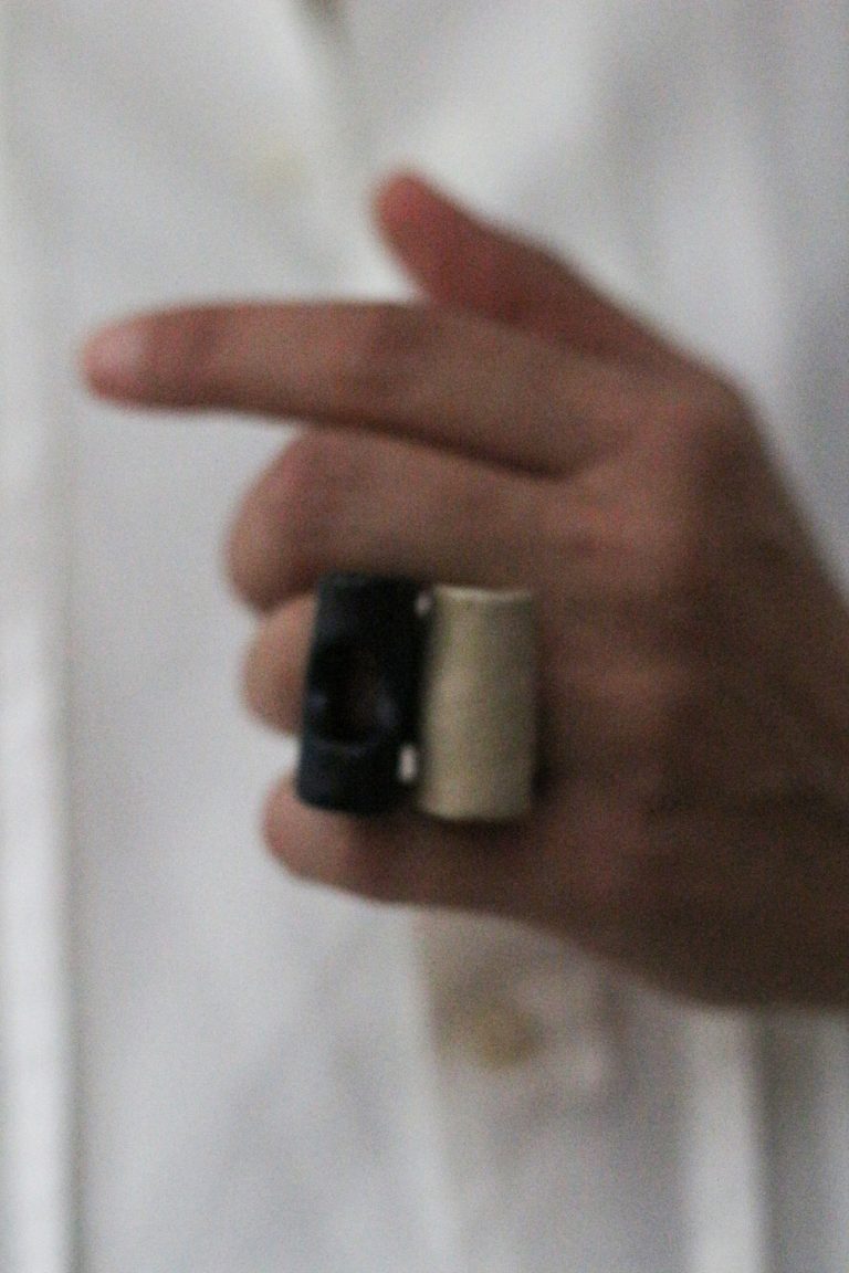 hand wearing ceramic rings