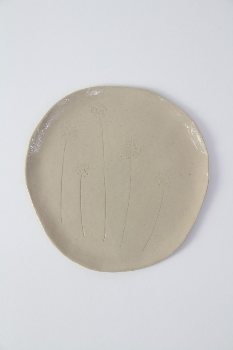 ceramic dish with plant engraving