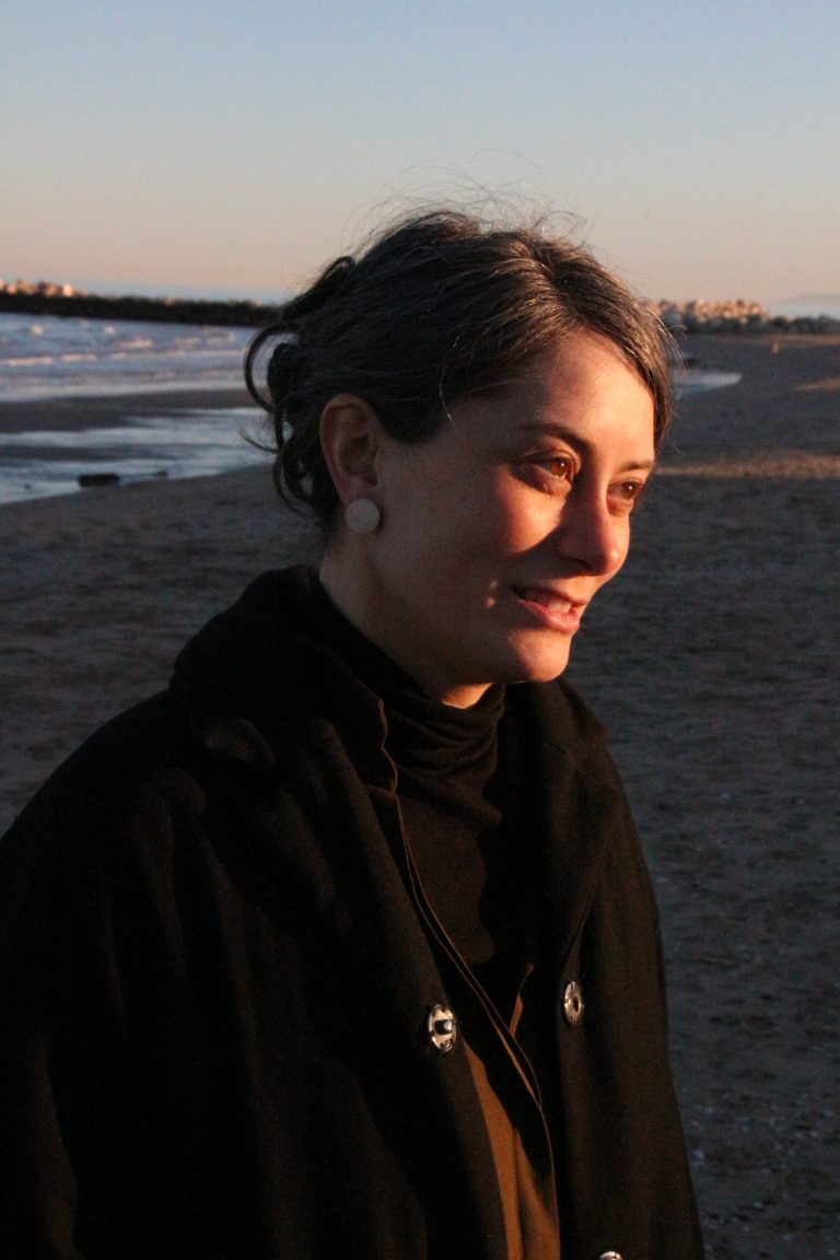 woman wearing ceramic earring