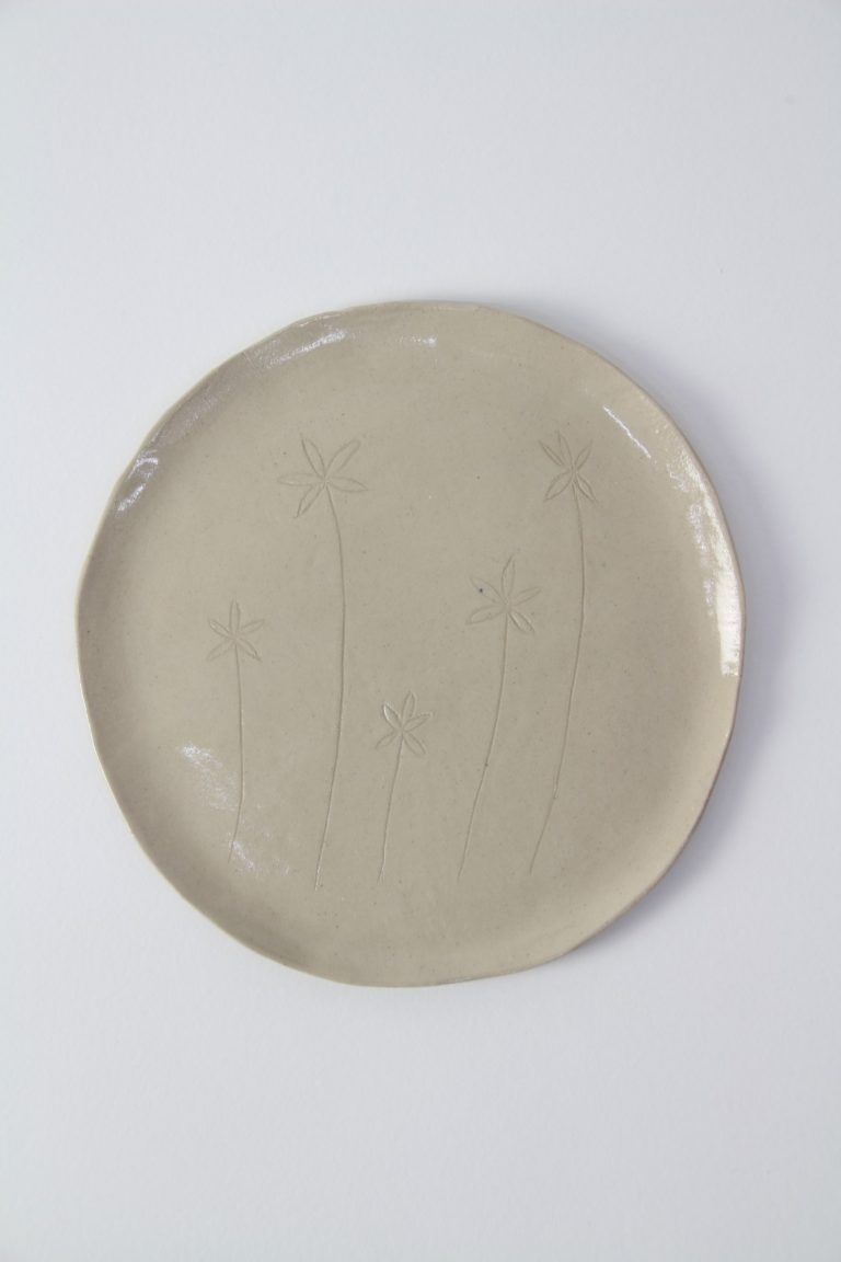 ceramic dish with plant engraving