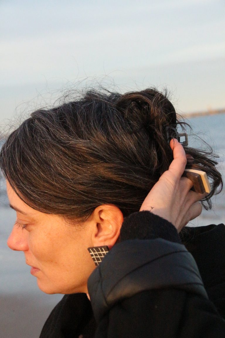 woman wearing ceramic earring