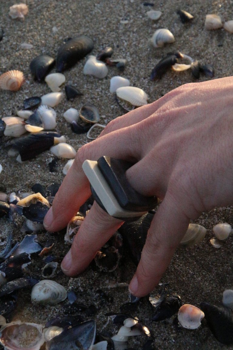 hand wearing a ceramic ring