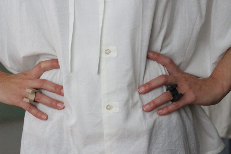 hands wearing ceramic rings