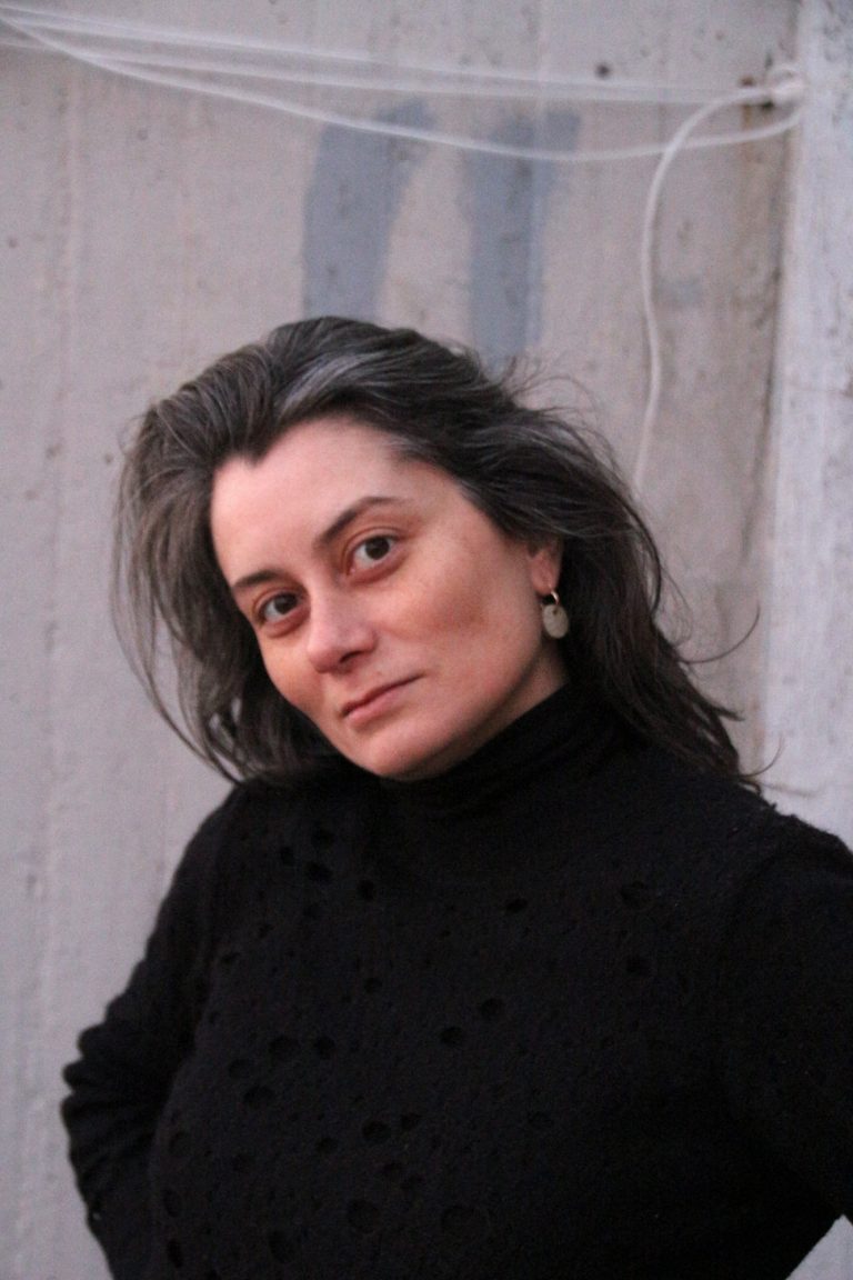 woman wearing ceramic earring hanger