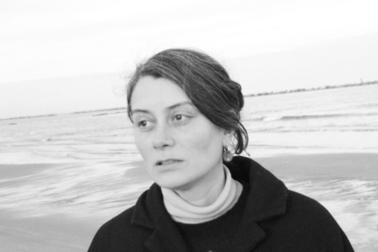 woman in front of the beach