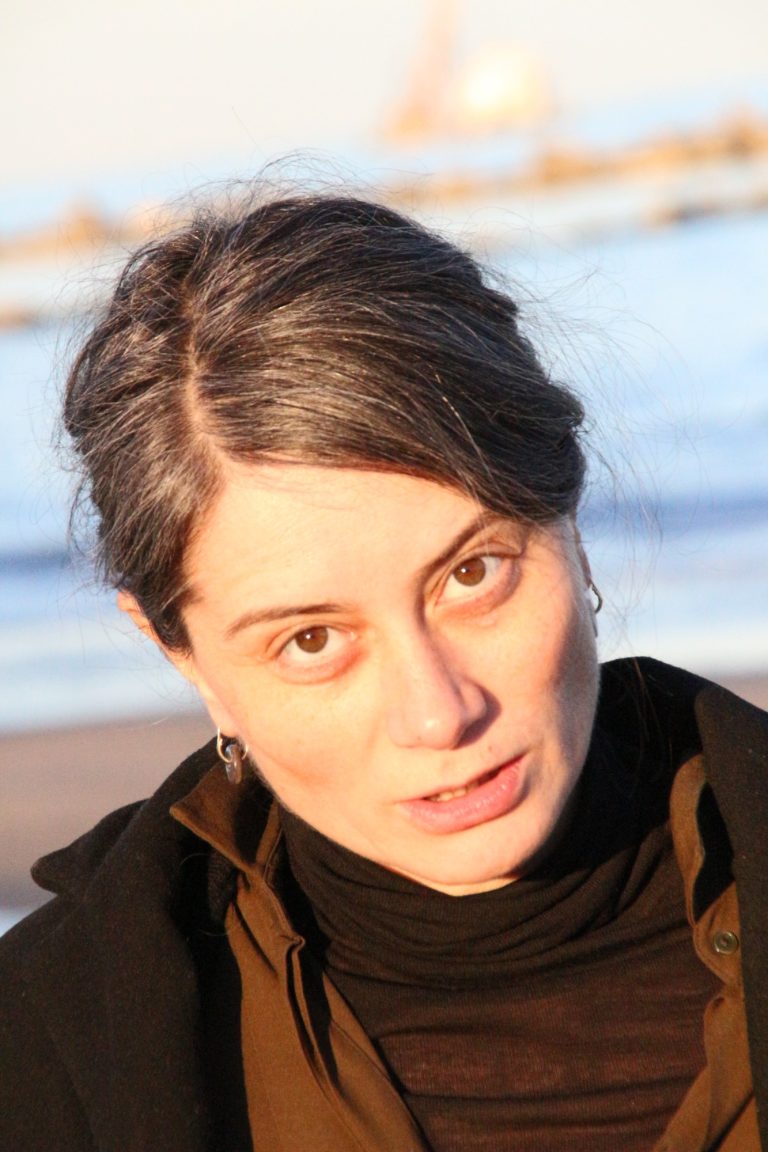 woman wearing ceramic earring hangers